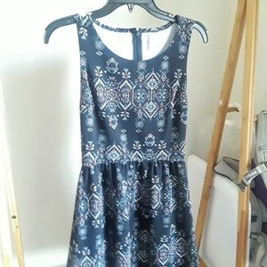 Sleeveless, black patterned dress